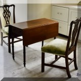 F67. Antique mahogany drop leaf table with drawer. 29”h x 35”w x 16”d 